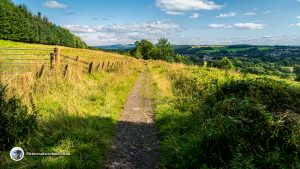 The path leads through fields back to the start