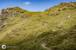 The path heads for a rocky outcrop